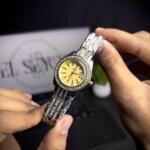 Women watch two tone with yellow color