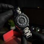 Magnetic balls movement close front wrist view with black straps