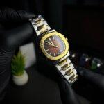 Patek phillippe geneve two tone front view with golden border
